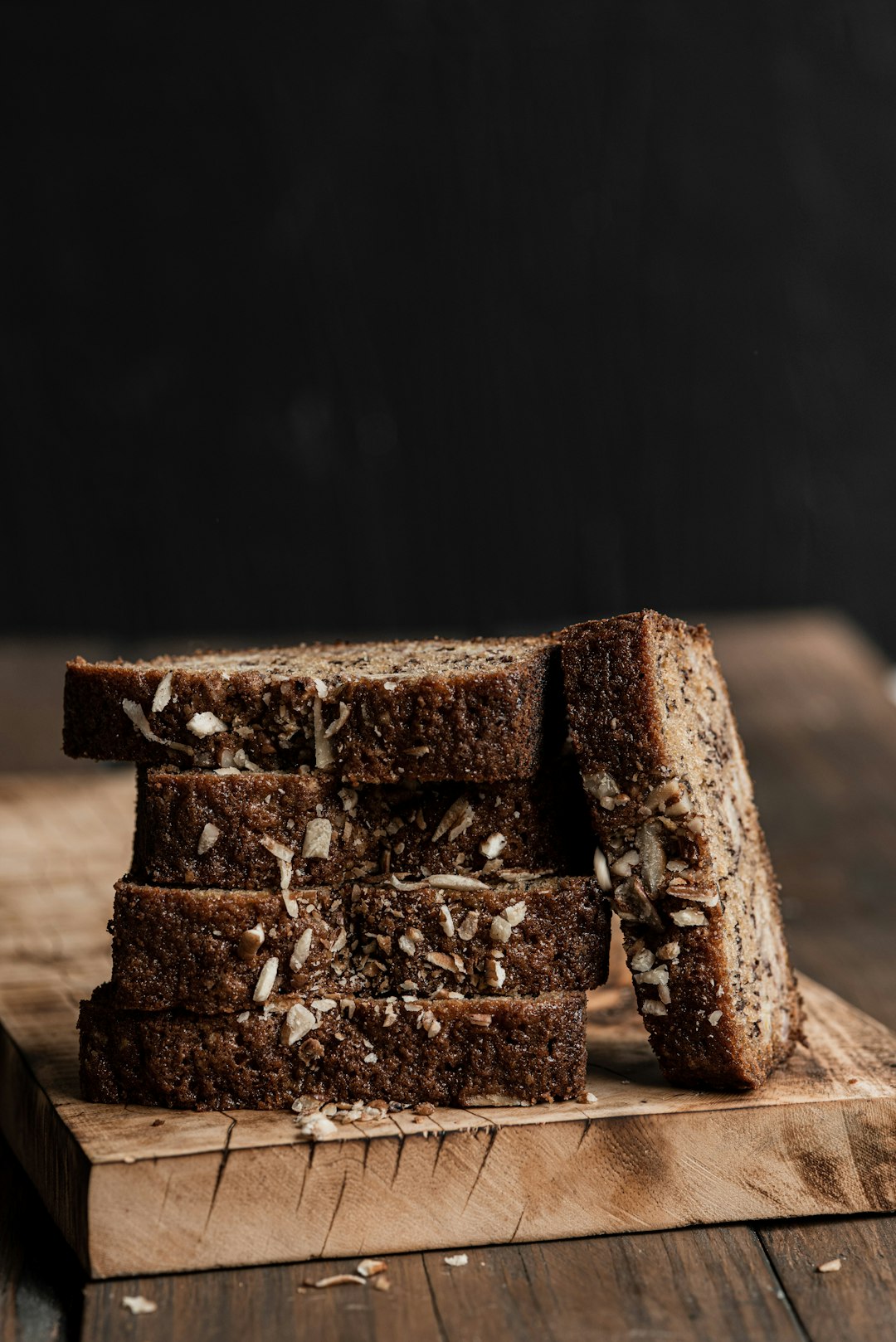Sliced seeded loaf on a wooden board