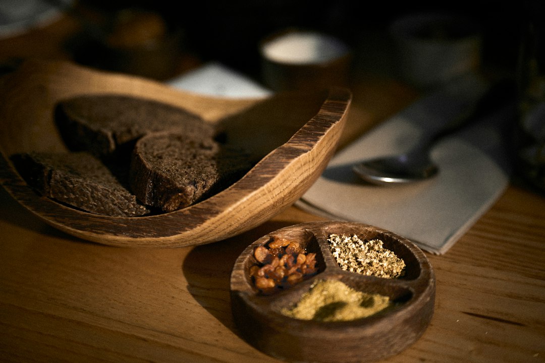 Dark rye bread with whole spices on a wooden table